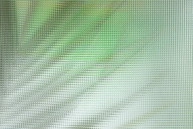 Açık yeşil arka planda egzotik palmiye yaprakları, kıvrımlı cam dokusu boyunca bitki siluetleri, soyut arkaplan  