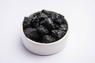 Shilajit is an ayurvedic medicine found primarily in the rocks of the Himalayas. selective focus