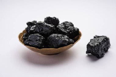 Shilajit is an ayurvedic medicine found primarily in the rocks of the Himalayas. selective focus