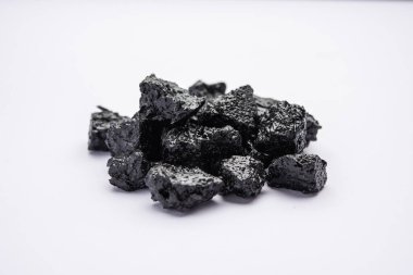 Shilajit is an ayurvedic medicine found primarily in the rocks of the Himalayas. selective focus