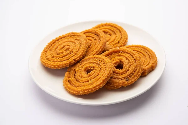 stock image Chakli is a savoury snack from India. It is a spiral shaped snack with a spiked surface