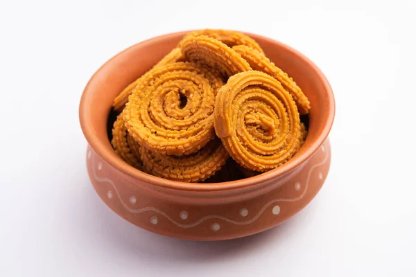 stock image Chakli is a savoury snack from India. It is a spiral shaped snack with a spiked surface