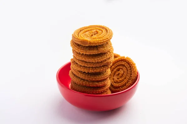 Stock image Chakli is a savoury snack from India. It is a spiral shaped snack with a spiked surface