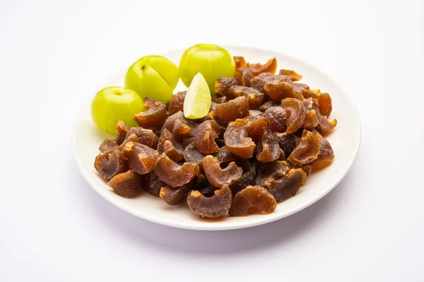 stock image digestive dried amla candy with fresh Indian gooseberry