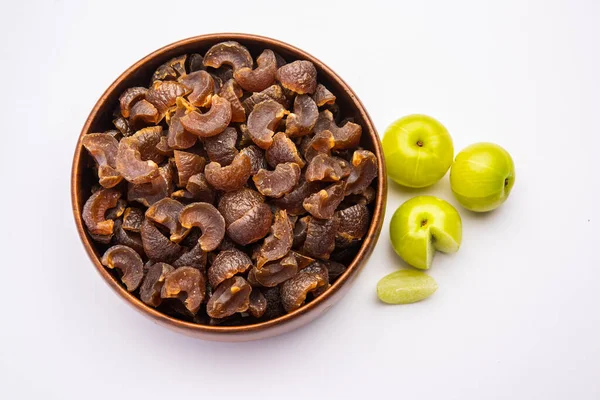 stock image digestive dried amla candy with fresh Indian gooseberry