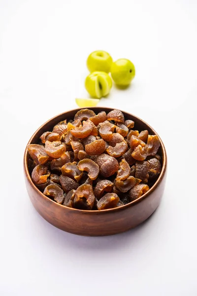 stock image digestive dried amla candy with fresh Indian gooseberry