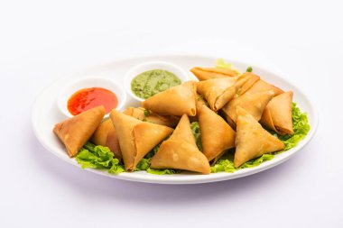 cocktail mini triangle samosa made using patti or strip, popular home made snack from India