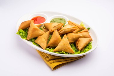 cocktail mini triangle samosa made using patti or strip, popular home made snack from India