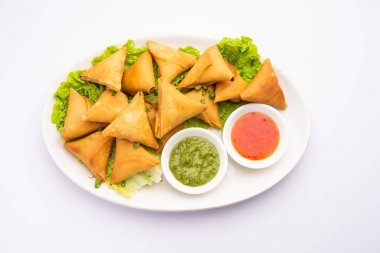 cocktail mini triangle samosa made using patti or strip, popular home made snack from India