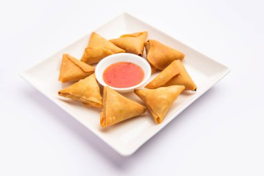 cocktail mini triangle samosa made using patti or strip, popular home made snack from India