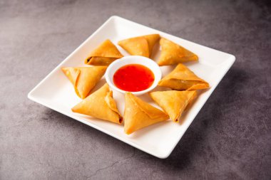 cocktail mini triangle samosa made using patti or strip, popular home made snack from India