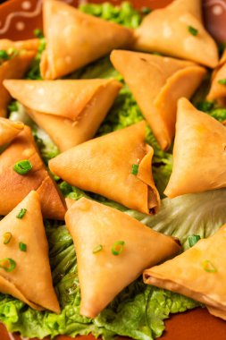 cocktail mini triangle samosa made using patti or strip, popular home made snack from India