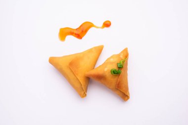 cocktail mini triangle samosa made using patti or strip, popular home made snack from India