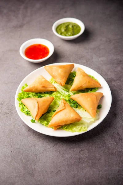 stock image cocktail mini triangle samosa made using patti or strip, popular home made snack from India