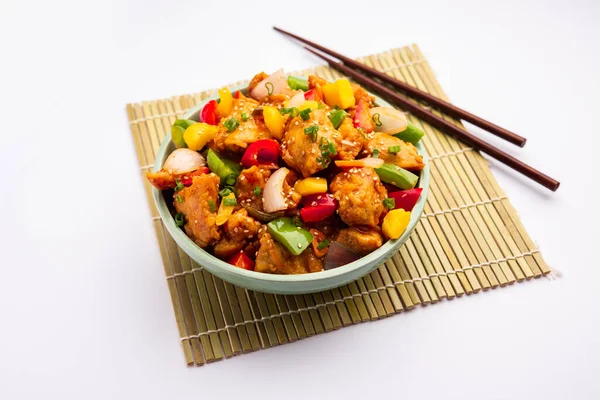 stock image Chilli chicken which is a popular Indo-Chinese starter dish, served on a plate or bowl. Selective focus