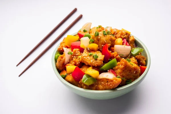 stock image Chilli chicken which is a popular Indo-Chinese starter dish, served on a plate or bowl. Selective focus