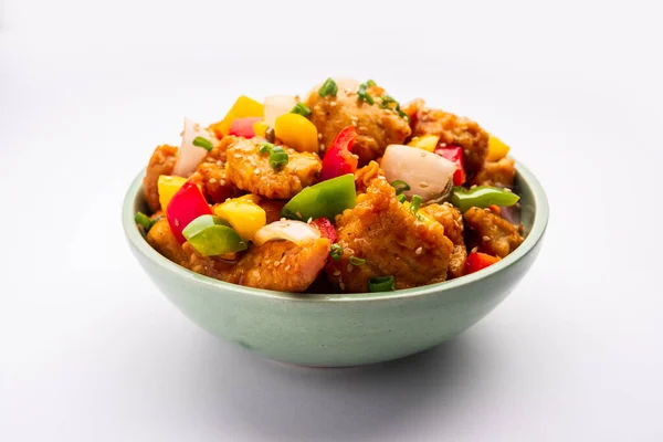 stock image Chilli chicken which is a popular Indo-Chinese starter dish, served on a plate or bowl. Selective focus