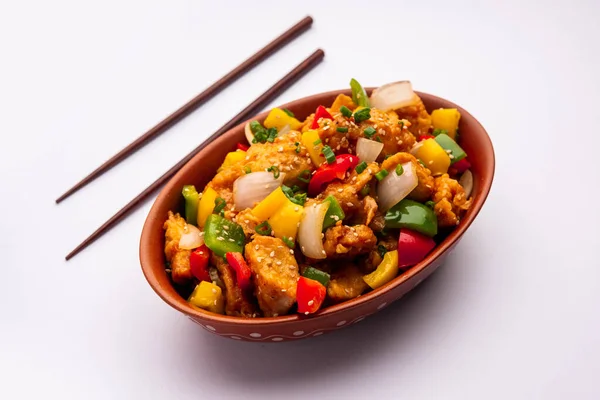 stock image Chilli chicken which is a popular Indo-Chinese starter dish, served on a plate or bowl. Selective focus