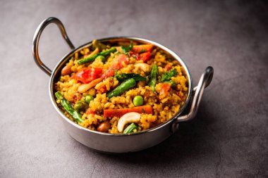 Bisi bele bath or bhath or huliyanna is a spicy, rice based dish from Karnataka, India