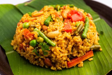 Bisi bele bath or bhath or huliyanna is a spicy, rice based dish from Karnataka, India