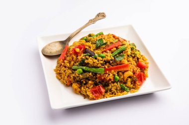 Bisi bele bath or bhath or huliyanna is a spicy, rice based dish from Karnataka, India