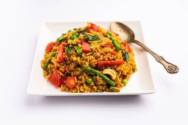 Bisi bele bath or bhath or huliyanna is a spicy, rice based dish from Karnataka, India