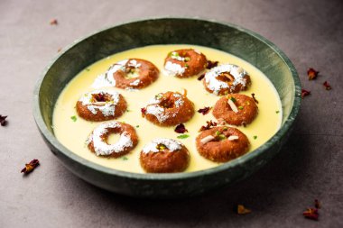 Rasbali is a traditional Indian sweet made from chhena or cottage cheese and dipped in sugar syrup