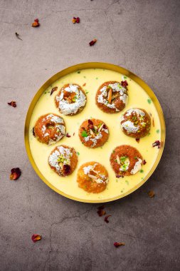 Rasbali is a traditional Indian sweet made from chhena or cottage cheese and dipped in sugar syrup