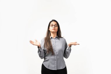 Mid age Asian Indian woman looking forward with confused expression