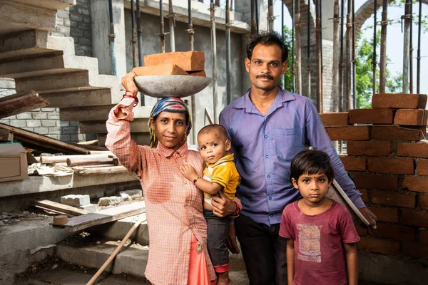 stock image Portrait of an Indian asian labour family working at construction site