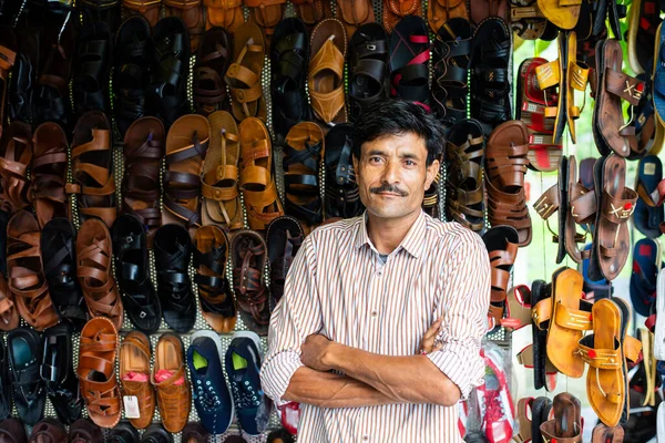 stock image Indian man selling footwear or chappal at roadside shop