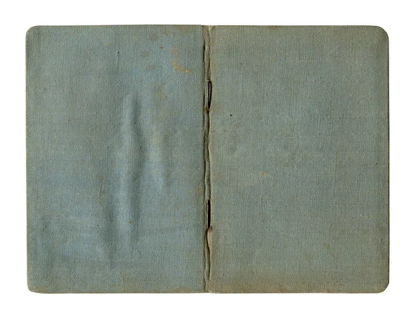前景特写小的旧式敞开式笔记本复古蓝色封皮 上面有污迹斑斑的皱巴巴的帆布 与白色隔离 — 图库照片