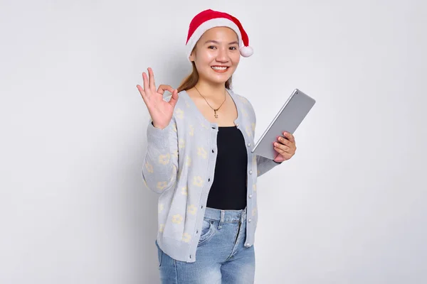 Cheerful Young Asian Woman Hat Christmas Holding Digital Tablet Showing Stock Image