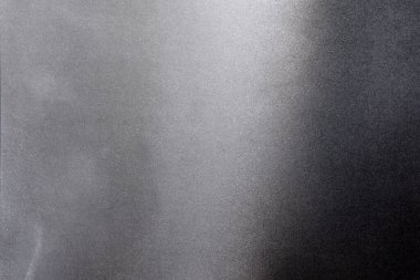 grey (silver) and black color spray paint gradient on white color paper