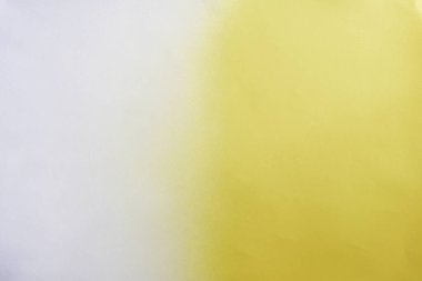 yellow color spray paint gradient on white color paper