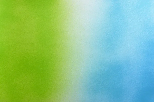 green and blue color spray paint gradient on white color paper