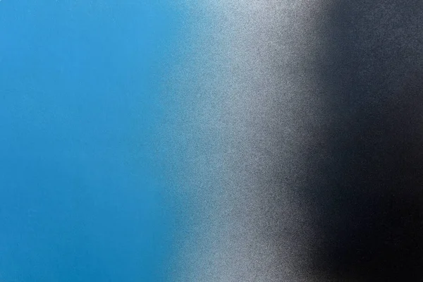 black and blue color spray paint gradient on white color paper