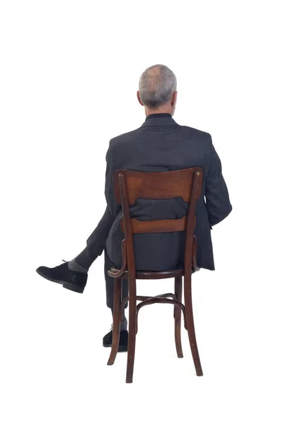Back View Man Sitting Chair Suit Tie Cross Legged White — Stock Photo, Image