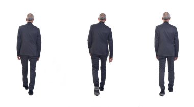 Beyaz arka planda yürüyen takım elbiseli aynı adam.