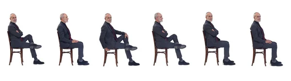 Boční Pohled Skupinu Stejného Muže Sedícího Židli Oblekem Kravatou Bílém — Stock fotografie