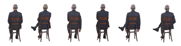Visão Traseira Grupo Mesmo Homem Sentado Cadeira Com Terno Fundo — Fotografia de Stock