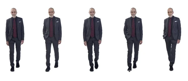 スーツを着た同じ男の集団の正面図白い背景を歩くネクタイ — ストック写真