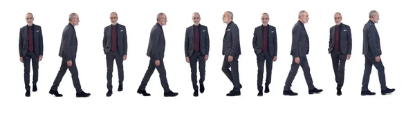 スーツを着て白い背景を歩く同じ男の正面と側面図 — ストック写真