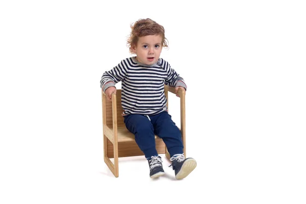 Front View Baby Boy Sitting Chair Looking Camera White Background Stock Picture