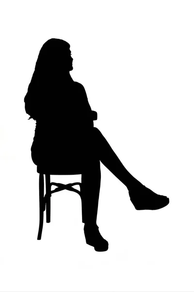 Ver Silhueta Menina Sentada Cadeira Vestido Curto Fundo Branco — Fotografia de Stock