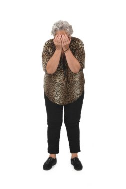 front view of a senior woman covering her face with her arm on white background clipart