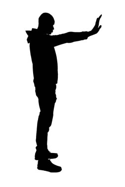  side view of a man showing stop sign with his hand on wite background