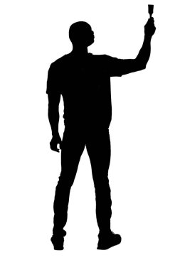 silhouette of back view of a standing man painting something imaginary