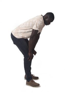 side view of a man standing leaning forward look down on white background