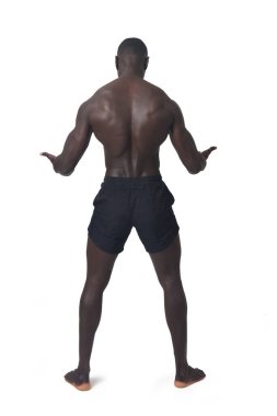 back view of a man holding or lifting something imaginary at waist level on a white background